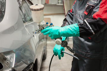 Image showing painting a car