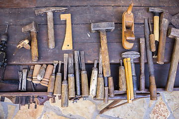 Image showing Vintage woodworking tools on a wooden workbench