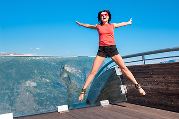 Image showing Excited woman tourist at Stegastein Viewpoint