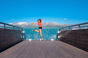 Image showing Excited woman tourist at Stegastein Viewpoint