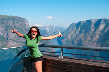 Image showing Excited woman tourist at Stegastein Viewpoint