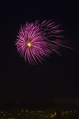 Image showing Fireworks over a town