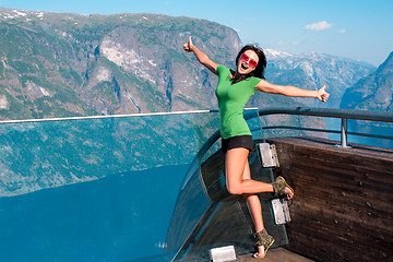 Image showing Excited woman tourist at Stegastein Viewpoint