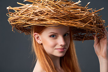 Image showing Smiling beautiful woman in natural wreath