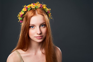 Image showing Beautiful red haired woman in flower wreath