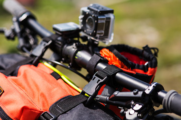 Image showing Bicycle with orange bags for travel