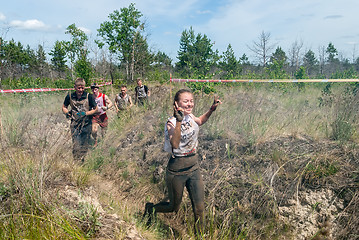 Image showing Sportsmen run between stages in extrim race.Tyumen