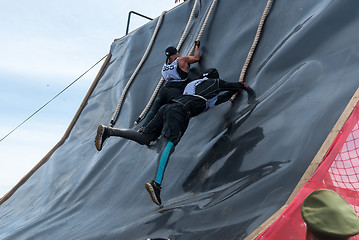 Image showing Sportsman storms big wall in extrim race. Tyumen