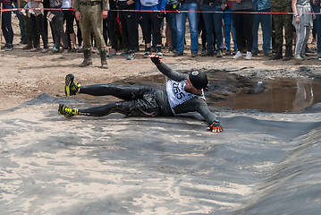 Image showing Sportsman storms big wall in extrim race. Tyumen