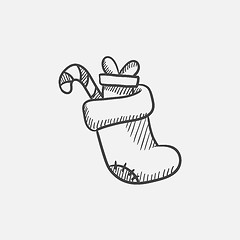 Image showing Christmas boot with gift and candy cane sketch icon.