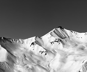 Image showing Black and white off-piste snowy slope in winter mountain