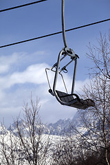 Image showing Ski lift in snow mountains at nice winter day