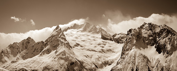 Image showing Panorama of sunny winter mountains in clouds