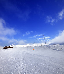 Image showing Snowboarder on ski slope in nice sun day