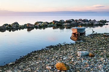 Image showing Sunset and fishing boat on the coast