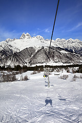 Image showing Chair-lift and Mount Ushba in sun day