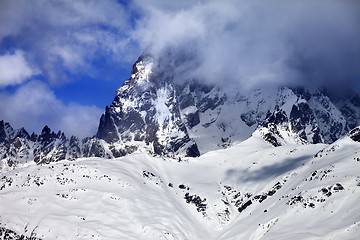 Image showing Mount Ushba in fog at sun winter day before storm