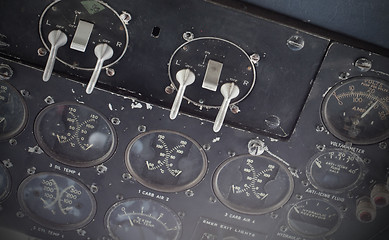 Image showing Different meters and displays in an old plane