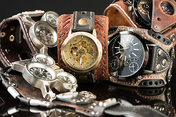 Image showing unusual watches. several alternatives dials