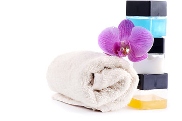 Image showing Stack of spa accessories with flower and towel