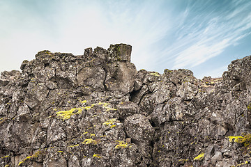 Image showing Rough cliffs with green moss