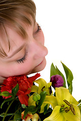 Image showing Young dreamy teenager girl with flowers