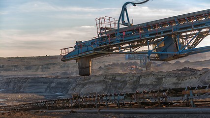 Image showing Long conveyor belt transporting ore