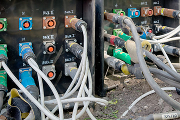 Image showing electrical power cables connected to a temporary outdoors distribution station