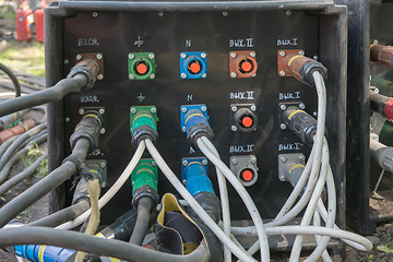 Image showing electrical power cables connected to a temporary outdoors distribution station