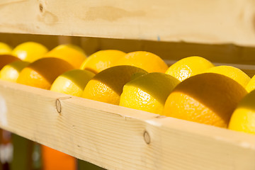 Image showing fresh oranges in a wooden box