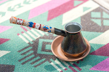 Image showing Turk for coffee with ornament on the handle