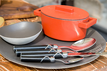Image showing new modern cast iron cauldron and kitchen appliances