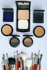 Image showing makeup brush and cosmetics, on a white background