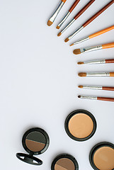 Image showing makeup brush and cosmetics, on a white background