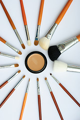 Image showing makeup brush and cosmetics, on a white background