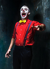 Image showing Terrible clown and Halloween theme: Crazy red clown in a shirt with suspenders