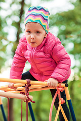 Image showing The little baby girl playing at outdoor playground