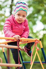 Image showing The little baby girl playing at outdoor playground