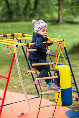 Image showing The little baby girl playing at outdoor playground