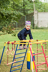 Image showing The little baby girl playing at outdoor playground