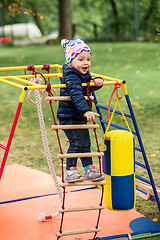 Image showing The little baby girl playing at outdoor playground