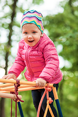 Image showing The little baby girl playing at outdoor playground