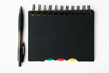 Image showing notepad with pen isolated