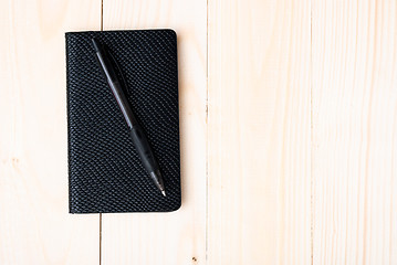 Image showing Small notepad with pen