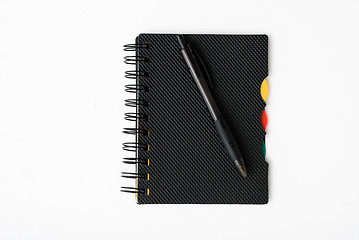 Image showing notepad with pen isolated