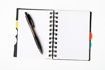 Image showing notepad with pen isolated