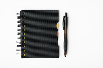 Image showing notepad with pen isolated