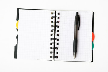 Image showing notepad with pen isolated