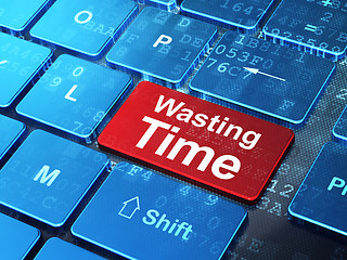 Image showing Timeline concept: Wasting Time on computer keyboard background