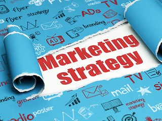 Image showing Marketing concept: red text Marketing Strategy under the piece of  torn paper